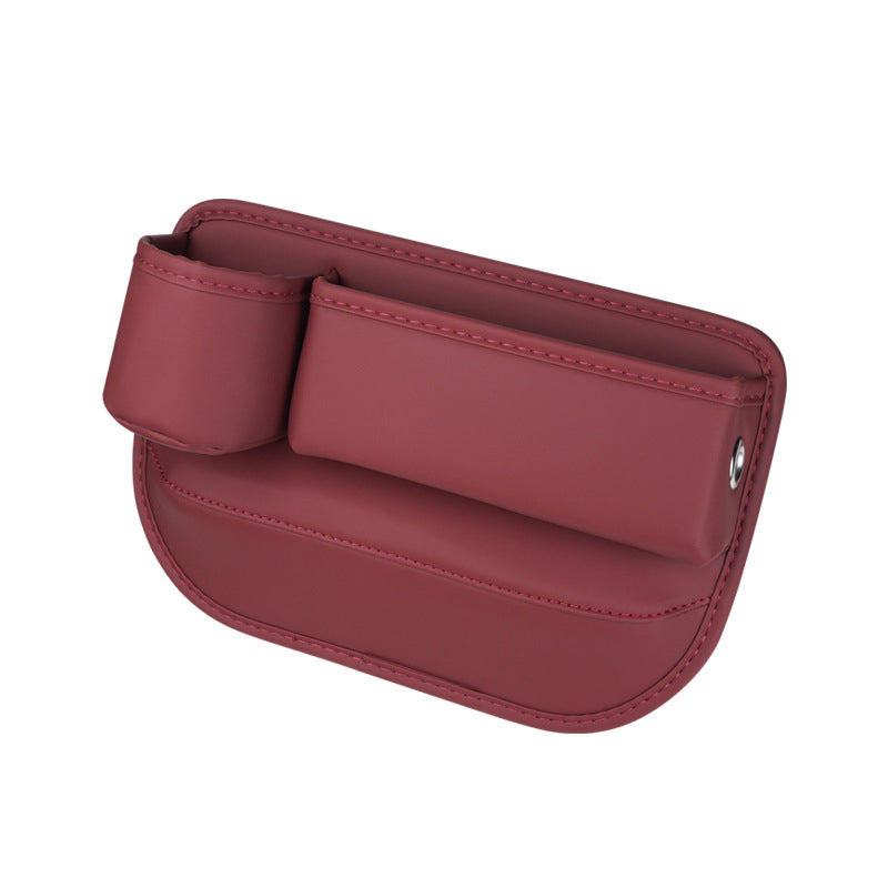 Seat gap organizer in red, left-facing studio view