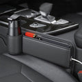 Seat gap storage box installed between seat and console holding cup, phone, and keys